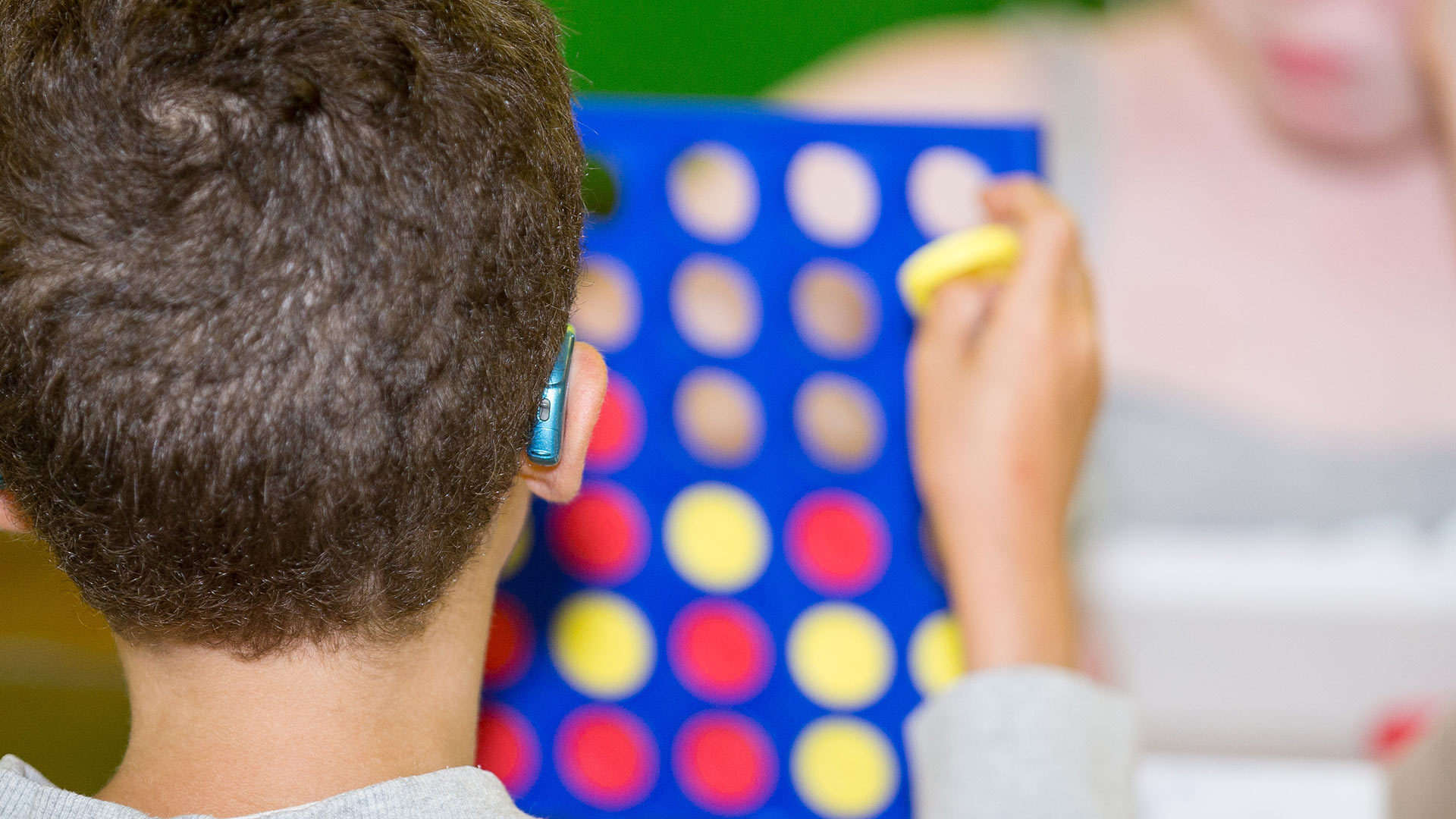 Two children playing Connect 4.