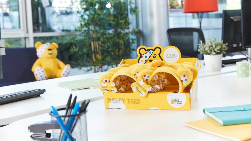 BBC Children in Need ears being sold in an office