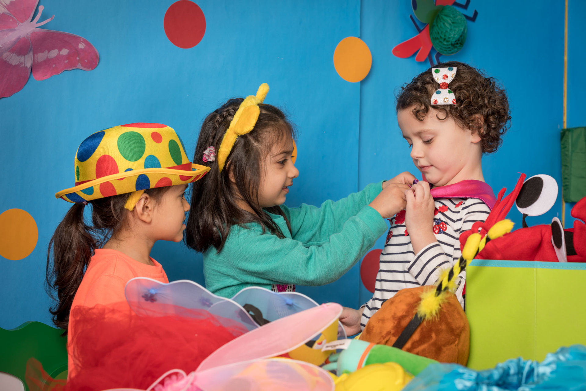 three children wearing fancy dress