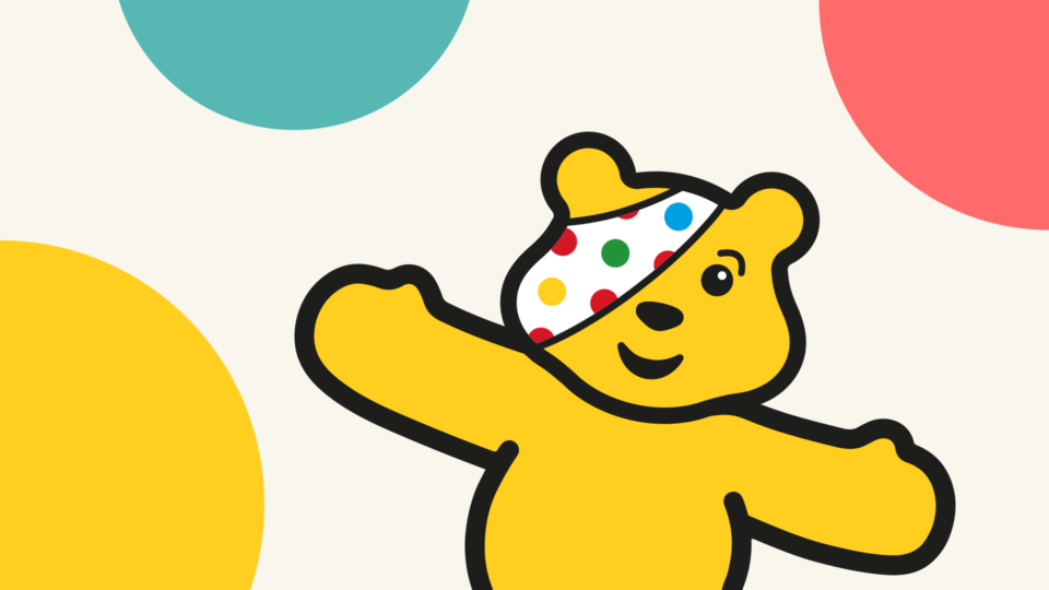 Pudsey against a spotty background.