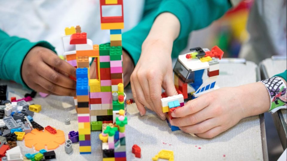 Children playing with Lego