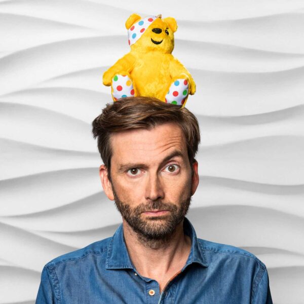 David Tennant balancing a Pudsey on his head
