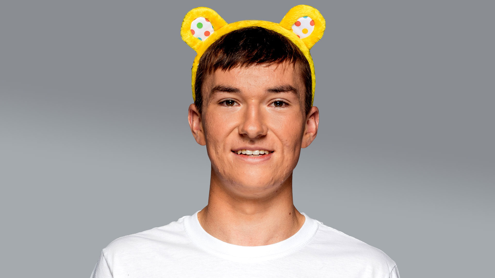 An image of Josh wearing Pudsey ears