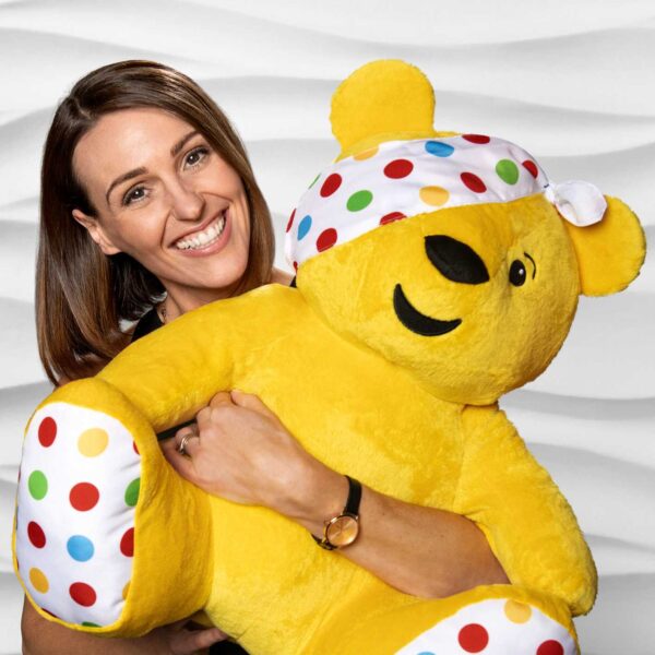 Suranne Jones holding a large Pusdey