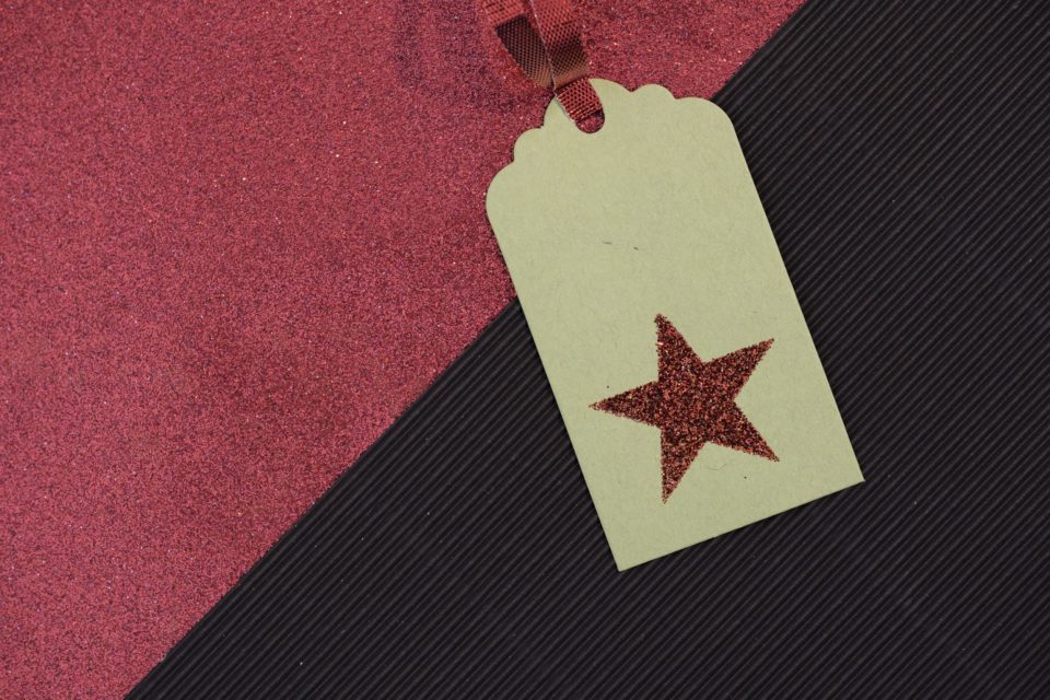 Secret Santa name tag with a red star on the label