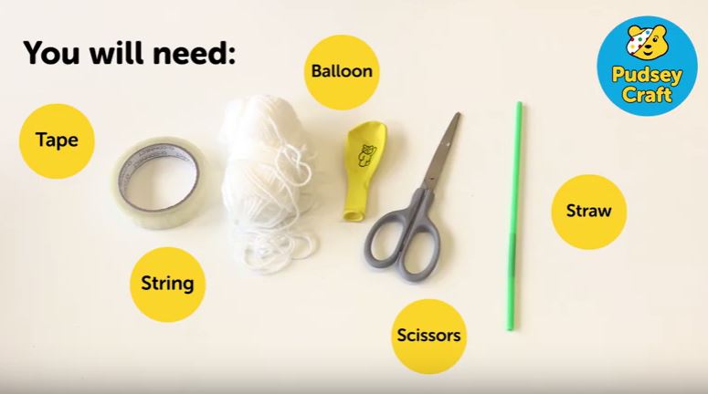 All the things you need to make a rocket, string, balloon, straw, scissors, tape