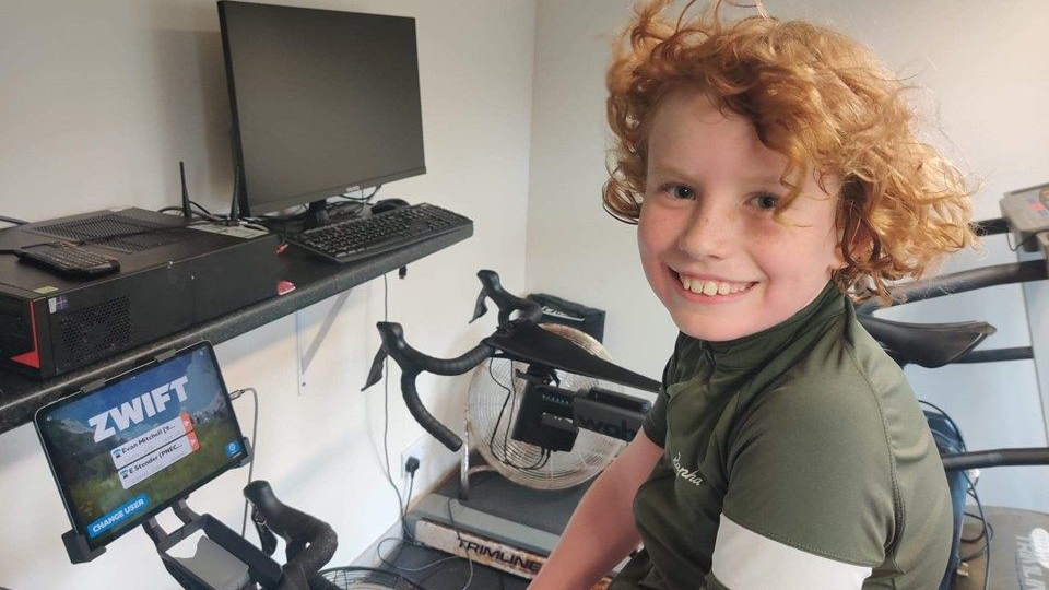 evan on an exercise bike