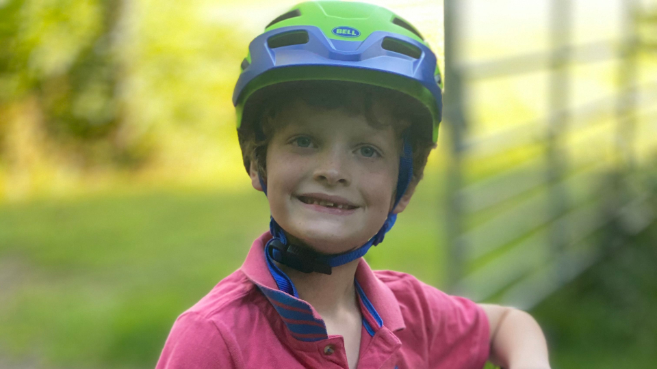 Seth wearing a cycle helmet