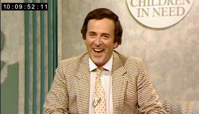 A young Terry Wogan wearing a checked jacket