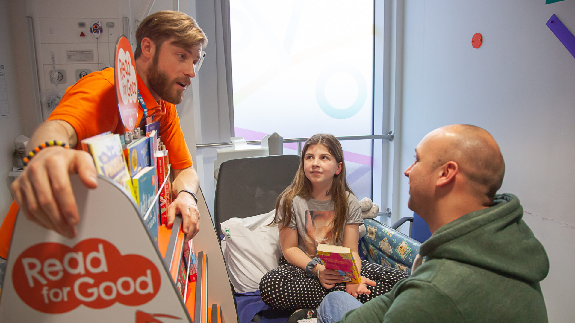 Ella on her hospital bed whilst Read for Good visit