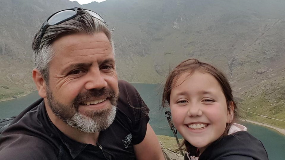 A man and girl hiking