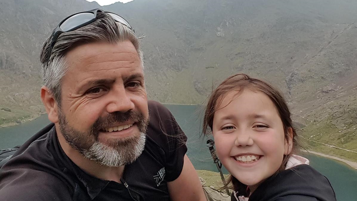 A man and girl hiking