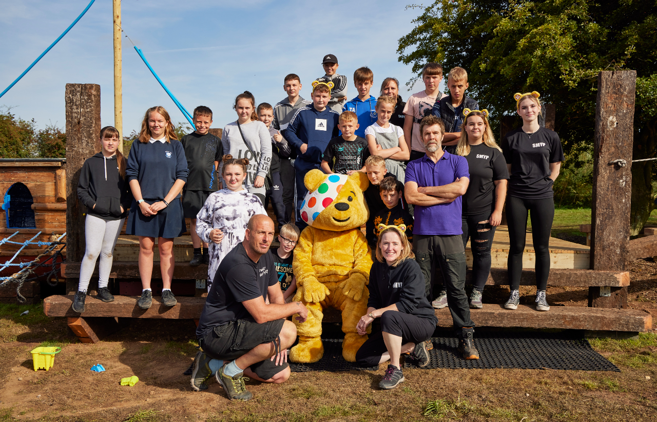 The DIY SOS team pose for a photo with Pudsey