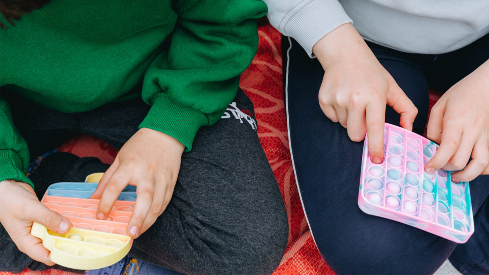 Children playing with popits