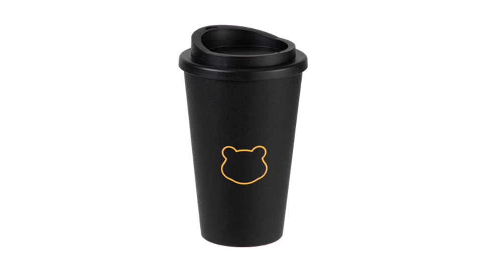 A black reusable coffe cup with a stylish yellow Pudsey head outline