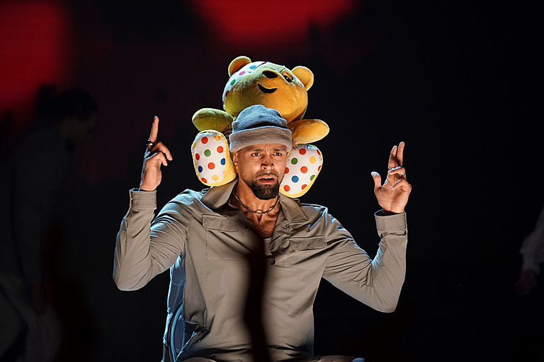 a member of diversity with a Pudsey plus toy on his shoulders