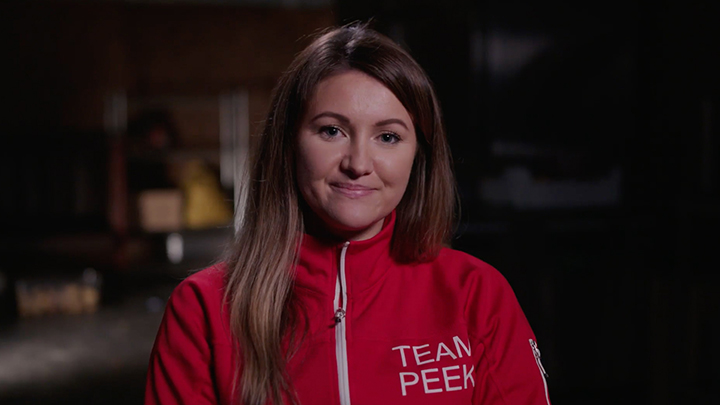 A lady wearing a PEEK tracksuit