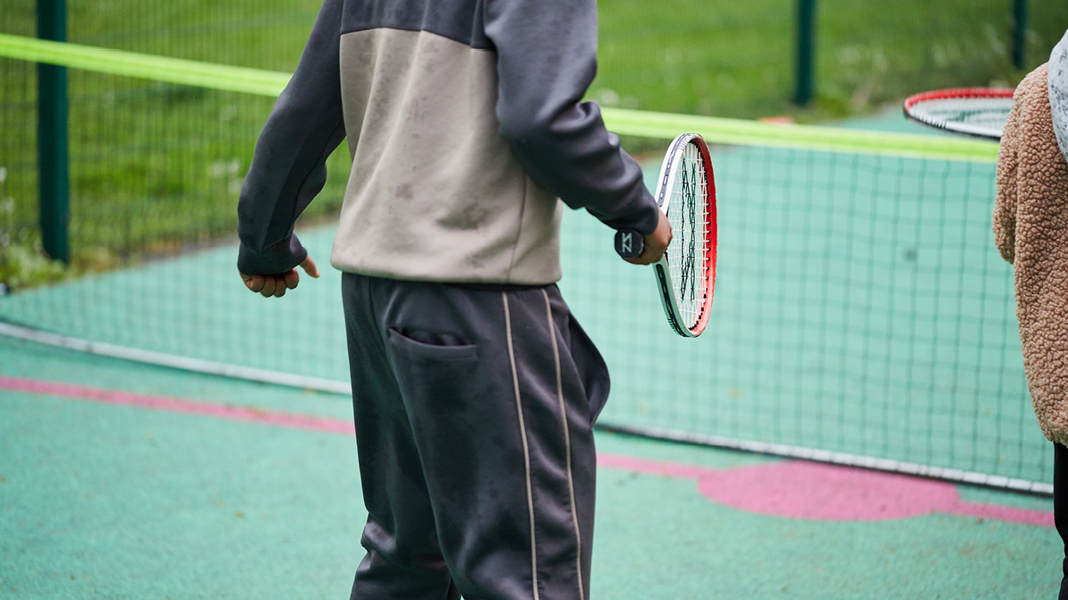 A child playing tennis