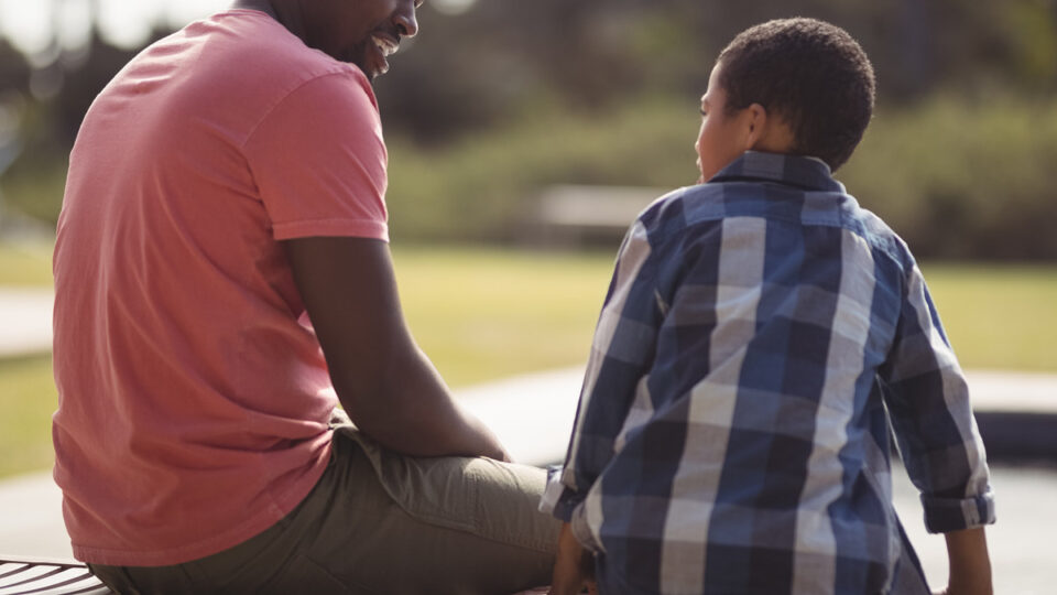 A child looking at an adult