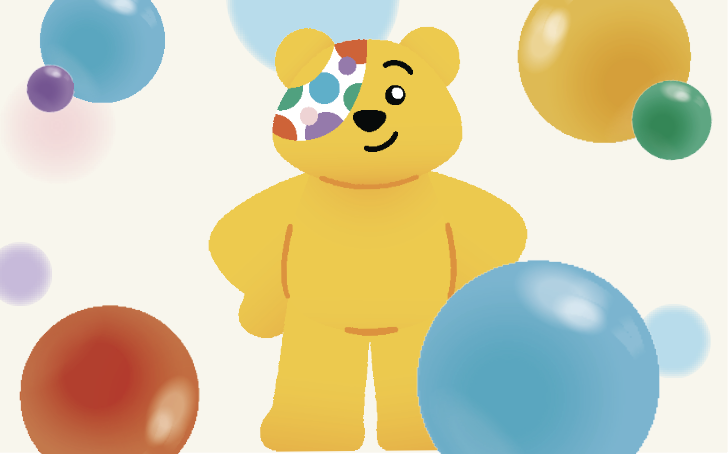 Pudsey bear surrounded by coloured spots