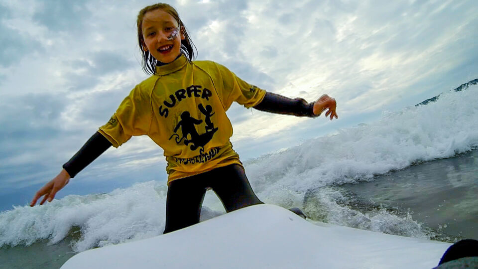 Imogen standing in the water smiling