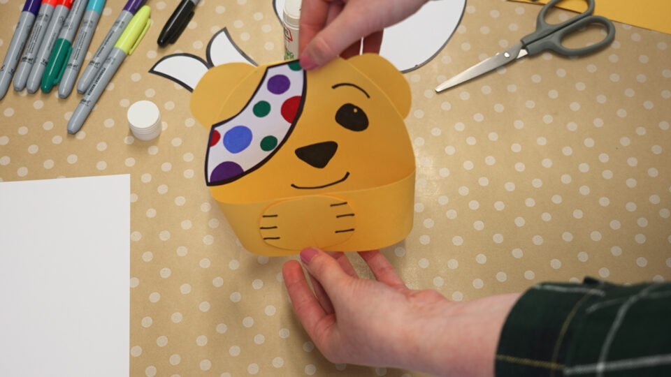 A cardboard Pudsey head
