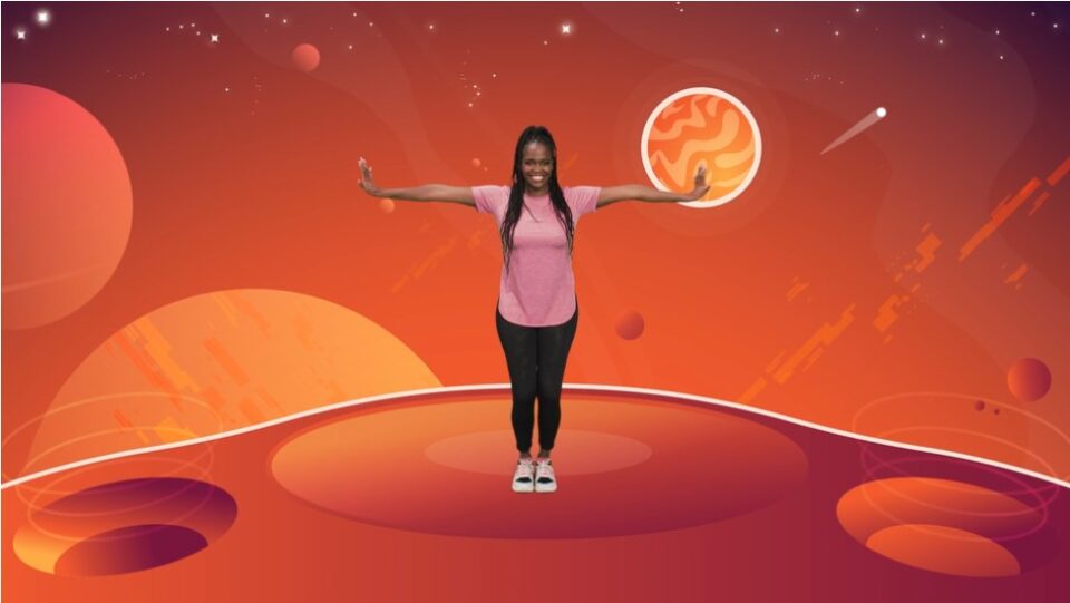 A lady dancing in front of an orange sky, as though on an alien planet