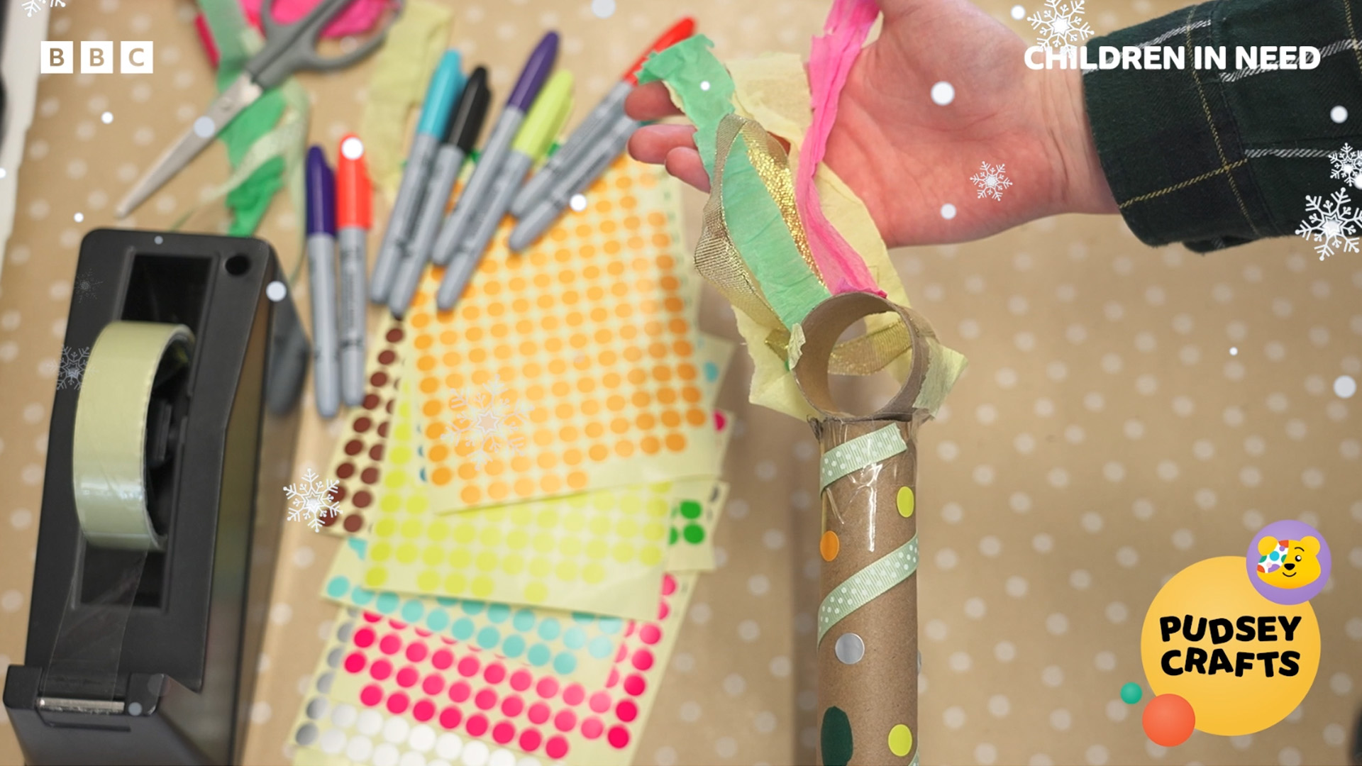 A screenshot from the breathing wand craft video showing a paper tube adapted with ribbons to be a wellbeing breathing wand
