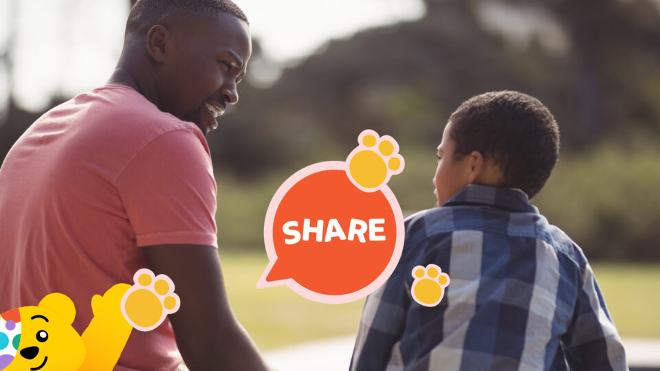 A child talking to a smiling adult