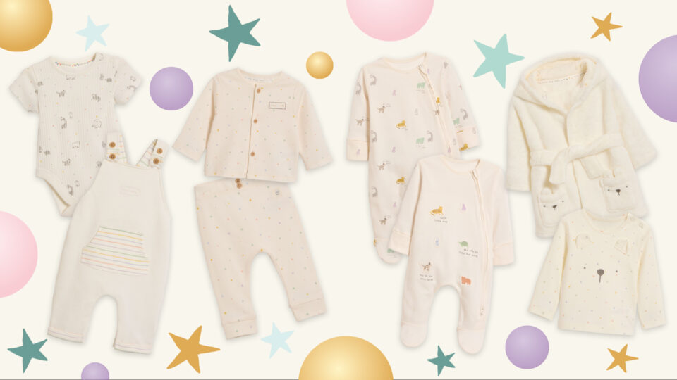 White baby clothes with a Pudsey design