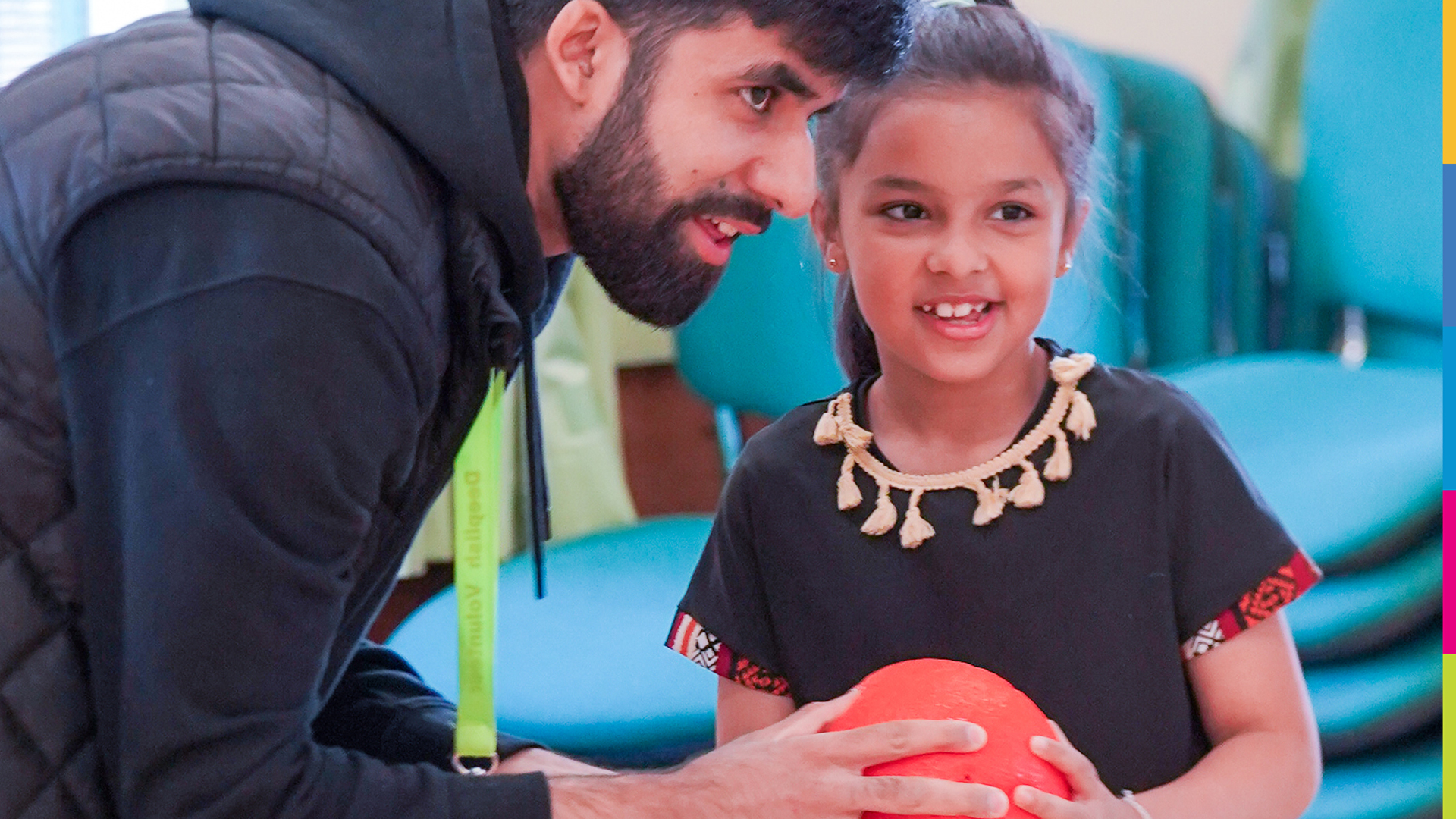 A project worker talking to a child