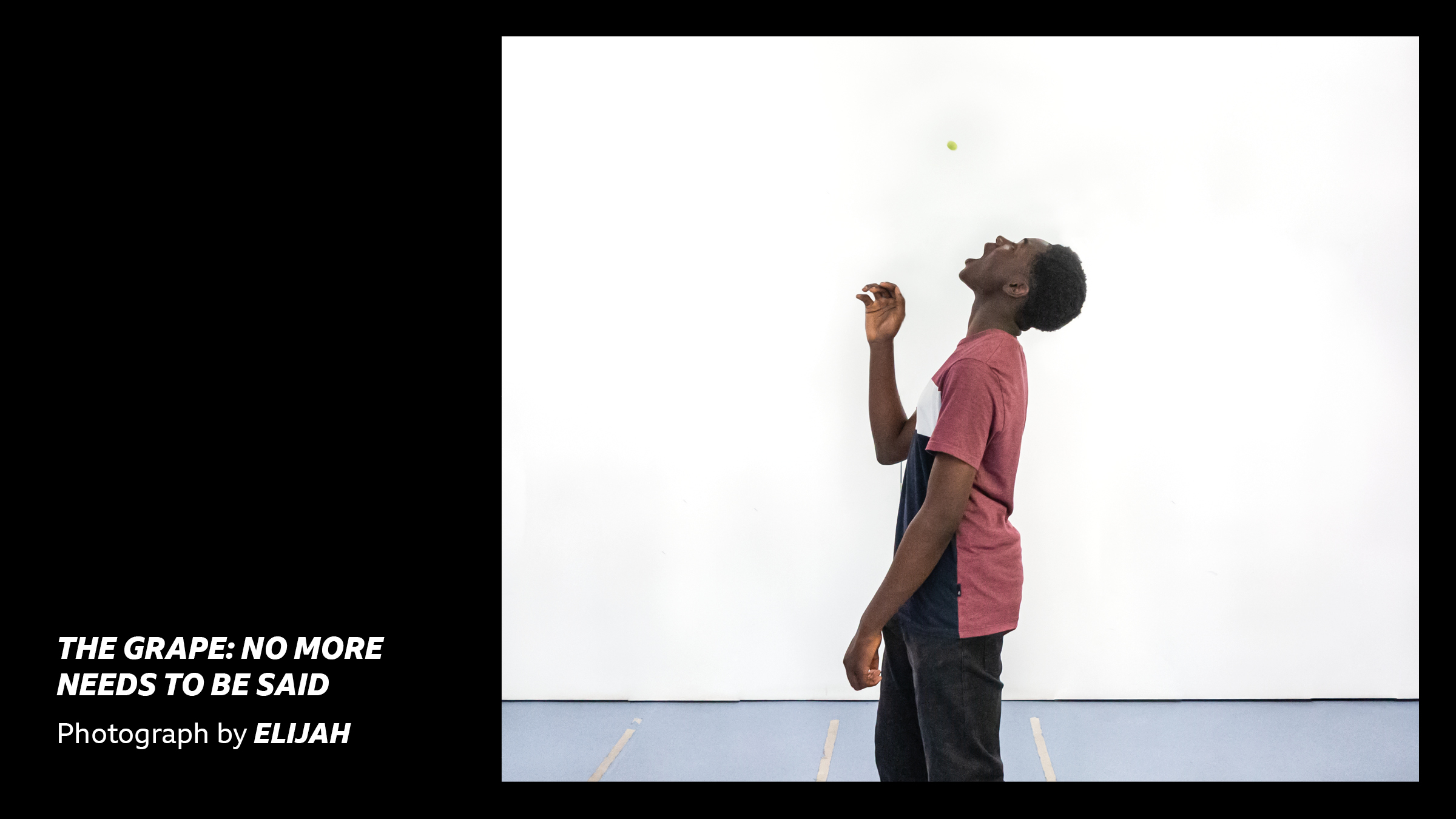 'The Grape: no more needs to be said - Photograph by Elijah' - a teenage boy throwing a grape in the air and looking up to catch it in his mouth