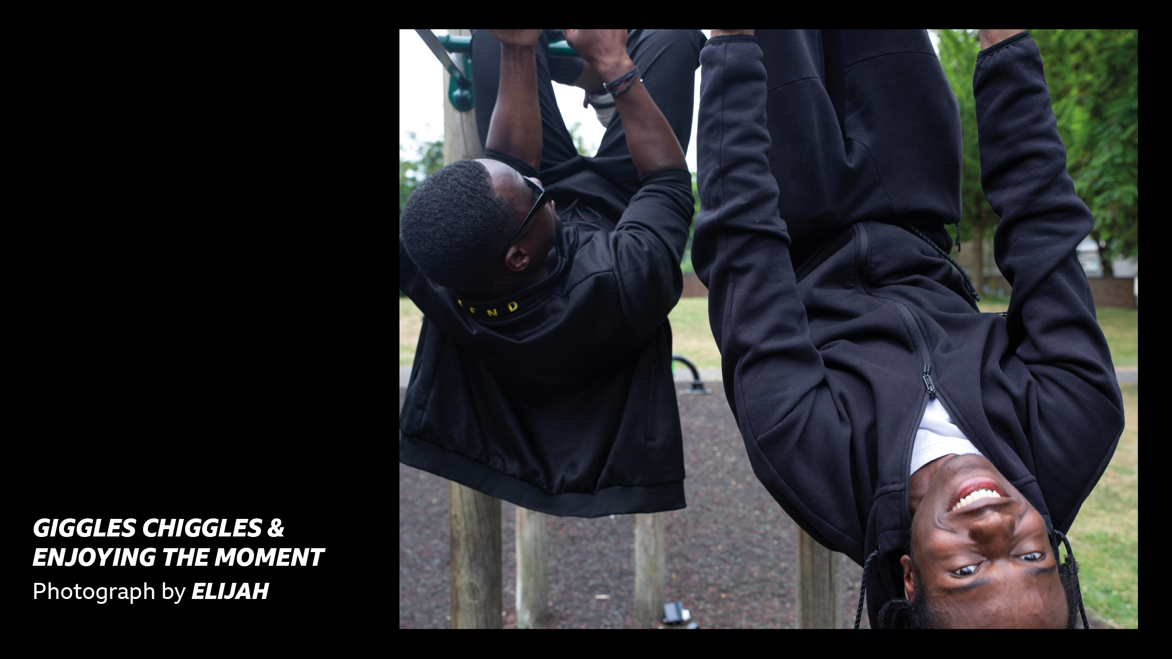 'Giggles, chiggles and enjoying the moment - Photograph by Elijah' Two boys hanging upside down on a climbing frame