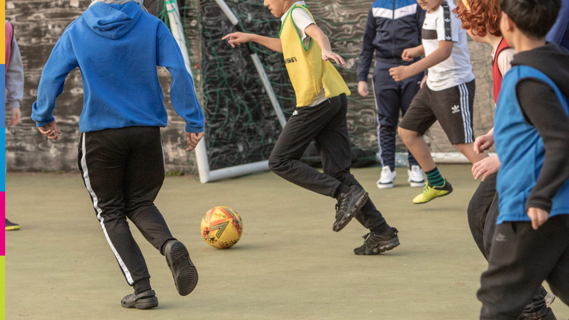 children playing football wearing Pudsey style yellow ears