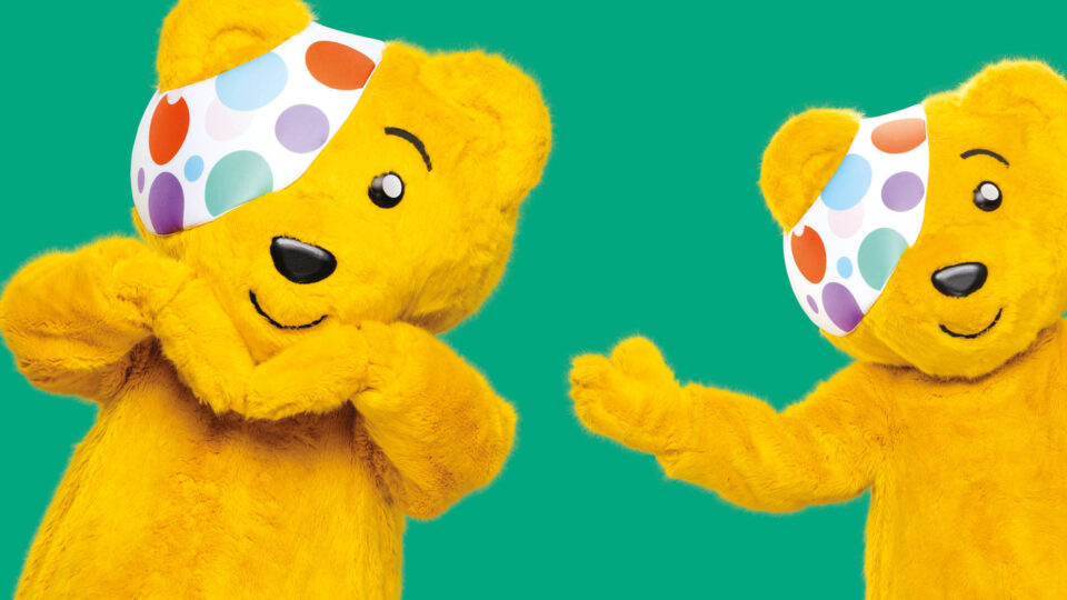 Real Life Pudsey Bear smiling and waving