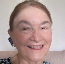 a lady smiling into the camera