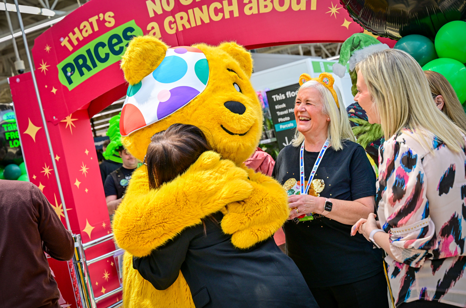 ASDA colleagues hug Pudsey Bear